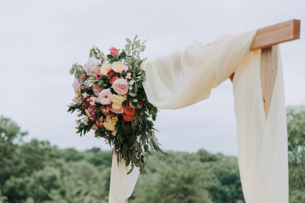 draped floral arch for wedding ceremony