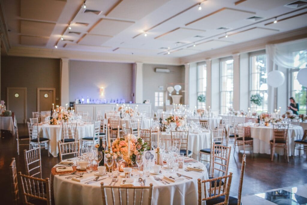 light and airy white and pink reception hall decorated
