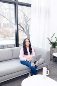 Woman sitting on the couch planning a wedding